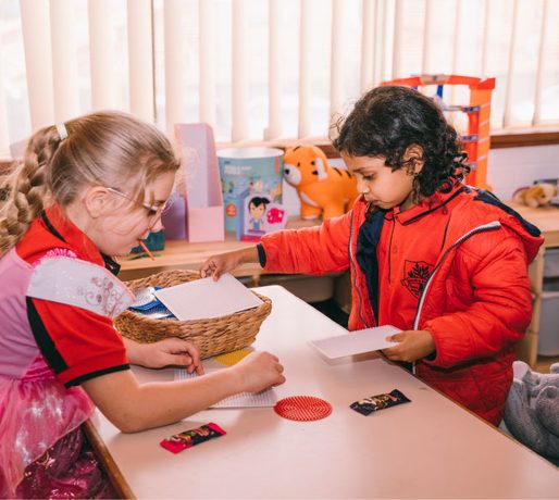 Children doing craft at a table